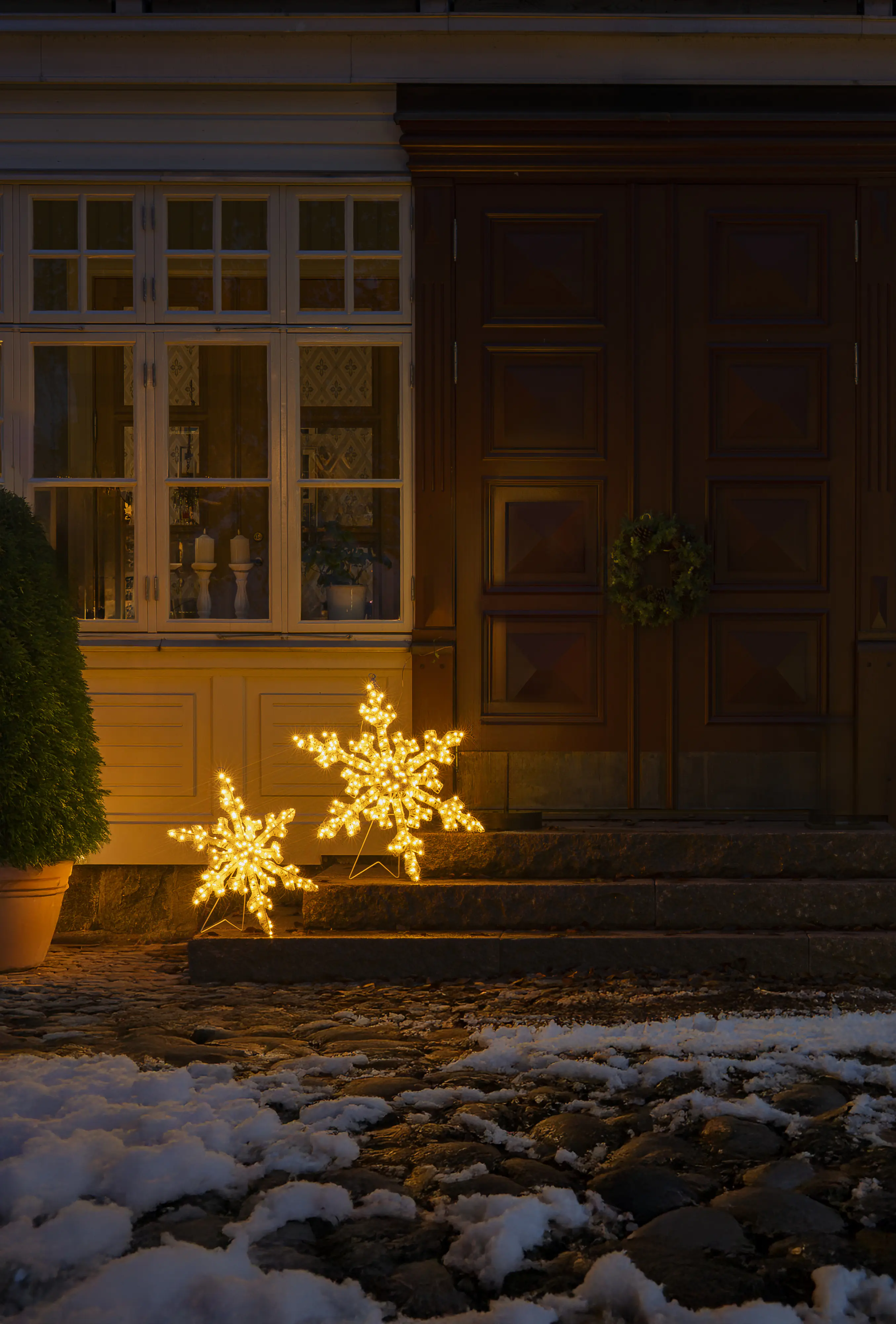 Konstsmide LED Weihnachtsdeko Schneeflocke 60 cm bernstein